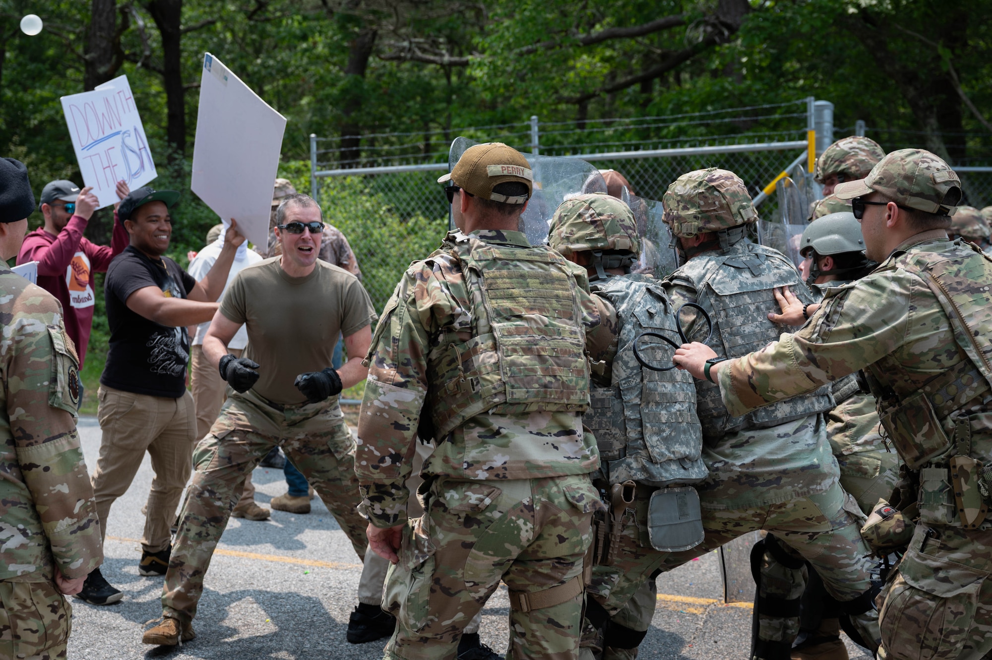 Airmen conduct riot control exercise.