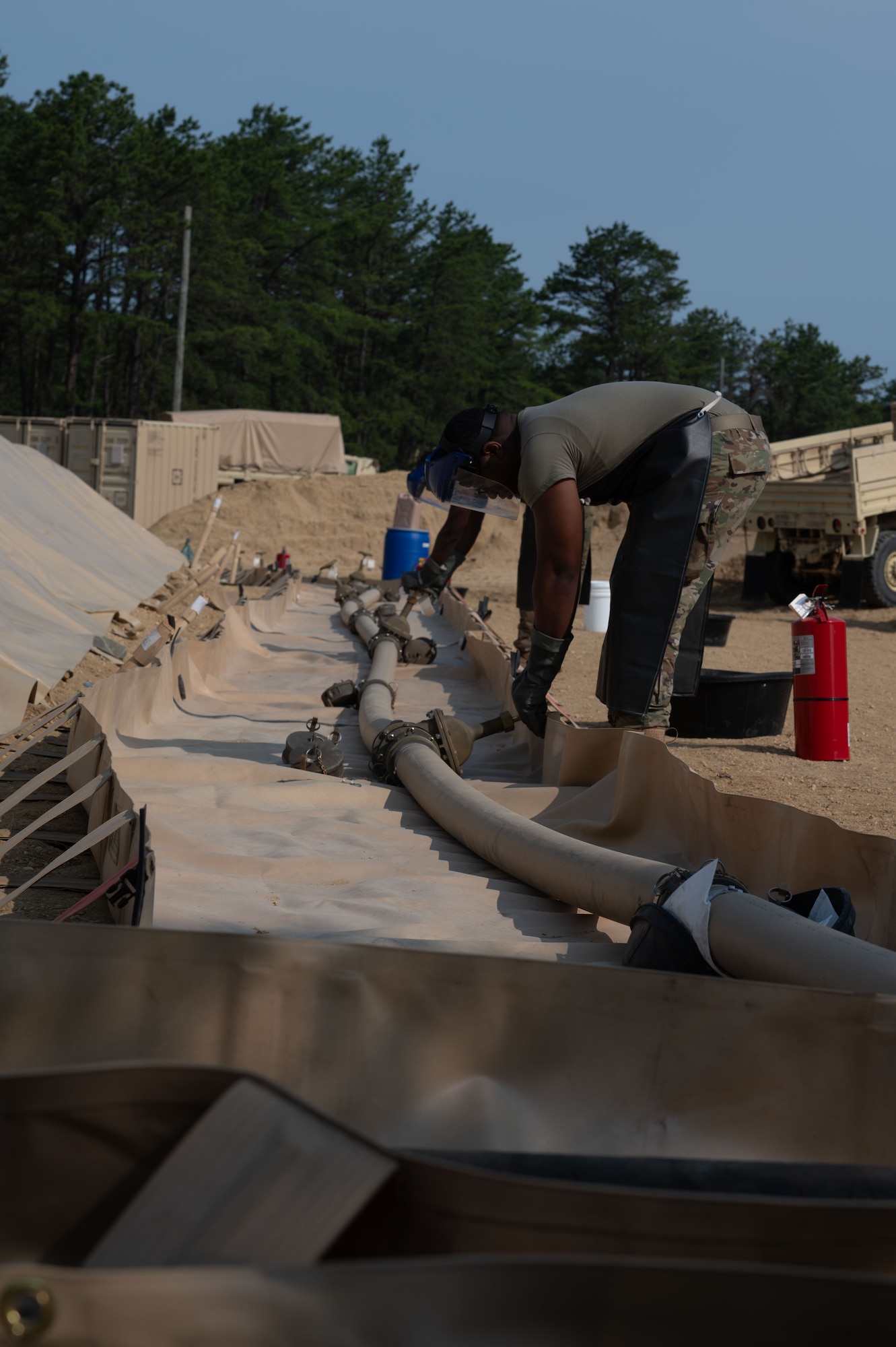 U.S. Army Reserve Soldiers assigned to the 233rd Quartermaster Company work on the fuel line during the Quartermaster Liquid Logistics Exercise.