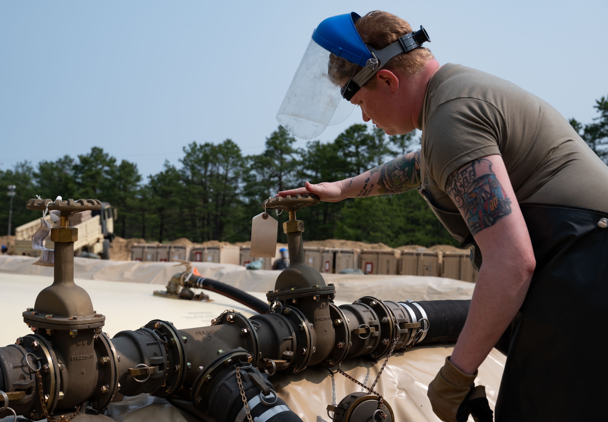 U.S. Army Reserve Spc. Alison Kaminski, 233rd Quartermaster Company petroleum supply specialist, works at the Fuel System Supply Point during the Quartermaster Liquid Logistics Exercise.