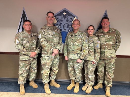  U.S. Space Force Col. Kenneth Klock, Space Base Delta 1 commander, and Chief Master Sgt. Martha Burkhead, SBD 1 senior enlisted leader, welcome Chief Master Sgt. Michael Rozneck, Space Operations Command senior enlisted leader, to Peterson Space Force Base, Colorado, June 10, 2025. Rozneck visited multiple units in SBD 1 for an immersion tour, while also recognizing outstanding performers. SBD 1 delivers integrated Base Operating Support, Combat Service Support, and Delta Staff Agency services to enable U.S. Space Force operations for 10 Space Deltas and more than 111 mission partners across 23 worldwide locations. (U.S. Space Force photo by Connie Dillon)