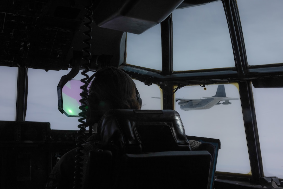 U.S. Marine Corps Capt. Carolyn Schaeffer, a pilot with Marine Aerial Refueler Transport Squadron (VMGR) 352, Marine Aircraft Group 11, 3rd Marine Aircraft Wing, flies a KC-130J Super Hercules in a formation flight during Exercise Sentry North in Wisconsin, June 4, 2025.