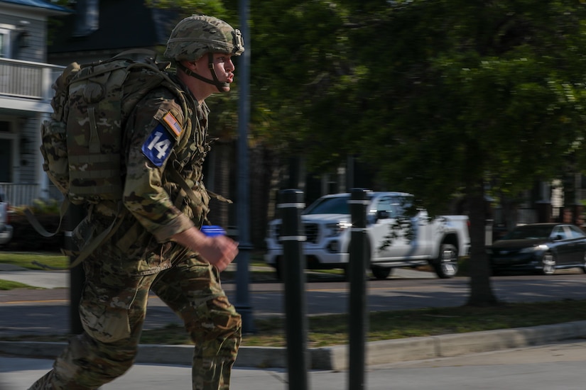 U.S. Army Spc. Syrus Butts, a cannon crewmember with Bravo Battery, 2nd Battalion, 138th Field Artillery, participates in the 12-mile ruck march of the Best Warrior Competition (BWC), Region III phase, ending at the Citadel in Charleston, South Carolina, April 23, 2025.