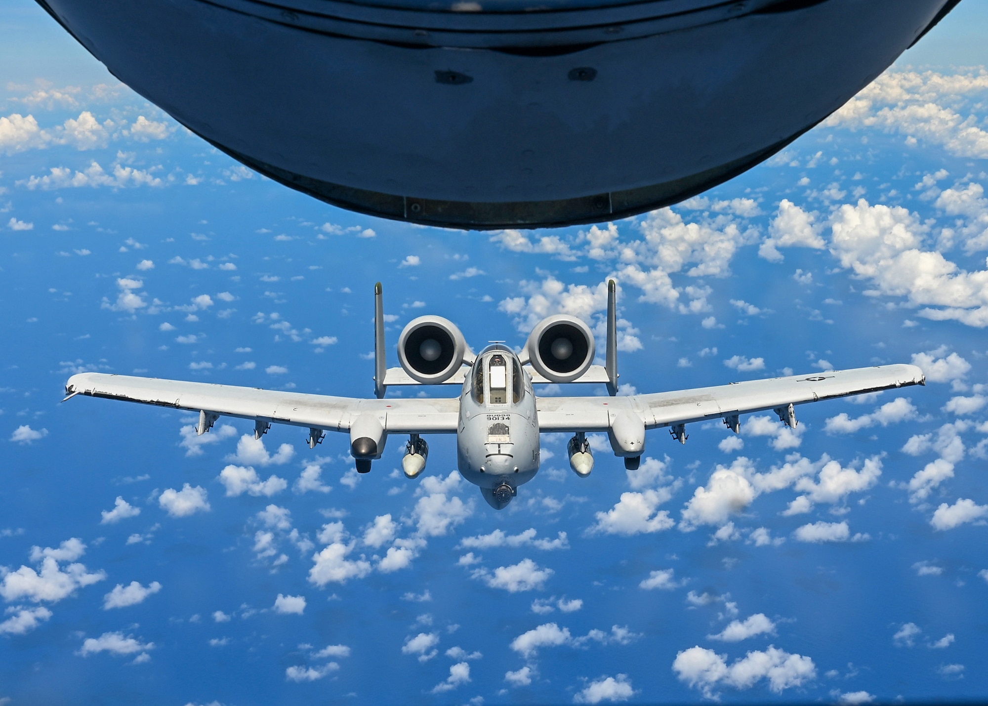 U.S. Air Force A-10 Thunderbolt II from the 25th Fighter Squadron, Osan Air Force Base, South Korea, fly in formation over Wake Island, June 7, 2025. The A-10 is a twin-engine, straight-wing, subsonic attack aircraft designed for close air support that has been flying for over 53 years.
