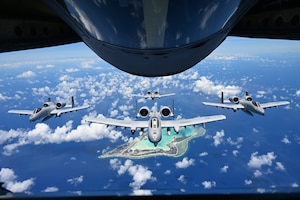 U.S. Air Force A-10 Thunderbolt II from the 25th Fighter Squadron, Osan Air Force Base, South Korea, fly in formation over Wake Island, June 7, 2025. The A-10 is a twin-engine, straight-wing, subsonic attack aircraft designed for close air support that has been flying for over 53 years.