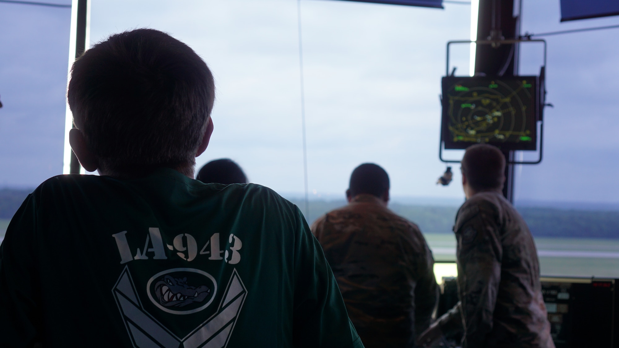 A Junior ROTC cadet tours an air traffic control tower.