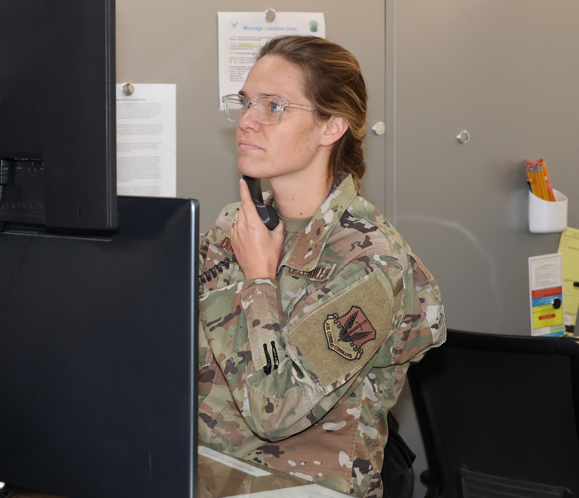 Senior Airman Mariah Dotson, Air Force Rescue Coordination Center search and rescue controller, coordinates with external agencies regarding the activation of an emergency beacon on Jun. 10, 2025.