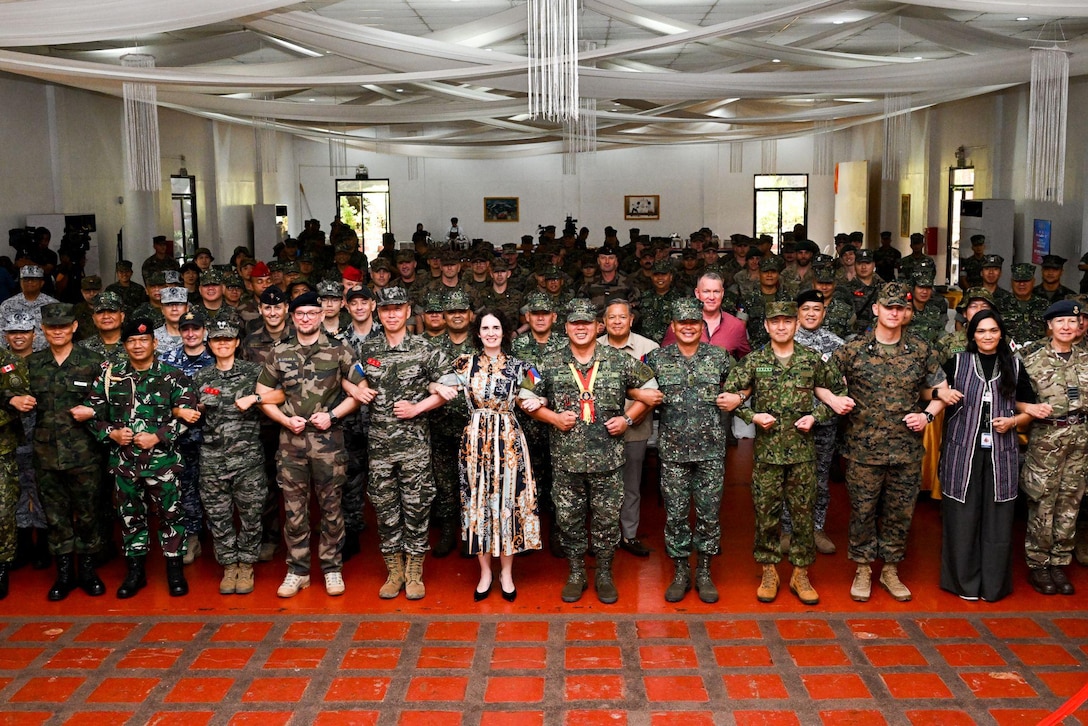 Philippine and international leaders stand shoulder-to-shoulder for a group photo during the KAMANDAG 9 opening ceremony at Fort Bonifacio, Manila, Philippines, May 26, 2025. KAMANDAG is an annual Philippine Marine Corps and U.S. Marine Corps-led exercise aimed at enhancing the Armed Forces of the Philippines’ defense and humanitarian capabilities by providing valuable training in combined operations with foreign militaries in the advancement of a Free and Open Indo-Pacific. (Courtesy photo provided by the Japan Ground Self Defense Force)