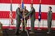 Lt. Gen. John P. Healy, Chief of Air Force Reserve and Commander, Air Force Reserve Command, passes the 10th Air Force guidon to Brig. Gen. Kevin Merrill, symbolizing Merrill’s official assumption of command. Standing ready to continue the tradition, Chief Master Sgt. Jeremy Allen prepares to receive the guidon as the incoming Command Chief of 10th Air Force.
