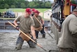 Airmen from various civil engineering specialties spread out concrete as they construct a Rapid Airfield Damage Repair system at Fort Indiantown Gap, Pennsylvania, June 9, 2025. The mock runway will be used as a training asset for the Air National Guard Schoolhouse, operated by the 193rd Special Operations Wing, to help civil engineering Airmen learn how to rapidly repair an airfield in combat situations. (U.S. Air National Guard photo by Tech. Sgt. Tony Harp)