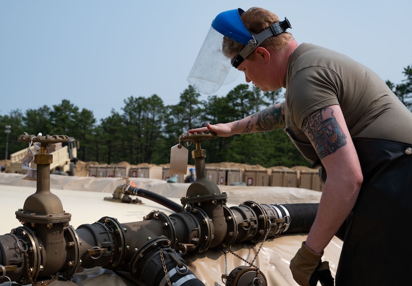 U.S. Army Reserve Spc. Alison Kaminski, 233rd Quartermaster Company petroleum supply specialist, works at the Fuel System Supply Point during the Quartermaster Liquid Logistics Exercise.