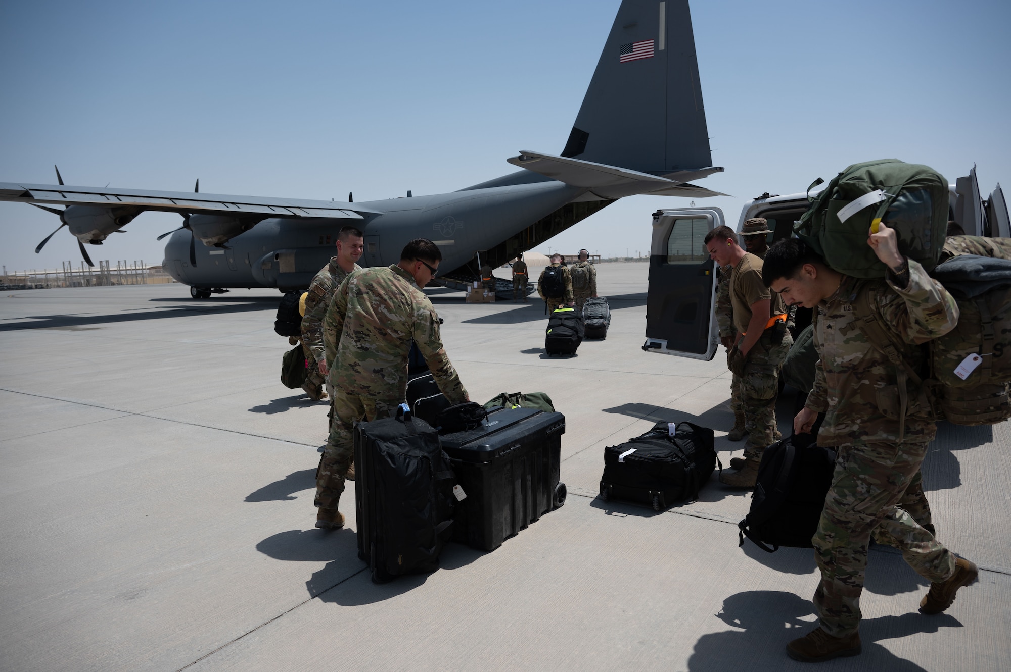 U.S. Air Force members assigned to the 40th Airlift Squadron board a C-130J in the U.S. Central Command area of responsibility, June 7, 2025. The C-130 can accommodate a wide variety of oversized cargo, including utility helicopters, six-wheeled armored vehicles and standard palletized cargo along with military personnel. (U.S. Air Force photo by Senior Airman Dieondiere Jefferies)
