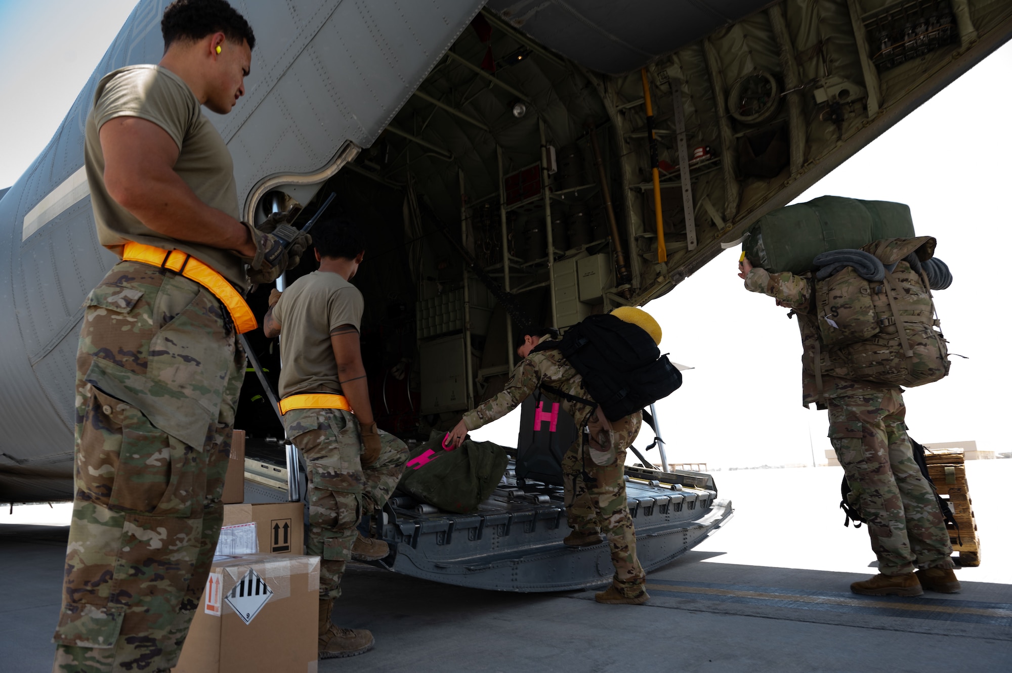 U.S. Air Force Airmen assigned to the 40th Airlift Squadron board a C-130J in the U.S. Central Command area of responsibility, June 7, 2025. The C-130 can accommodate a wide variety of oversized cargo, including utility helicopters, six-wheeled armored vehicles and standard palletized cargo along with military personnel. (U.S. Air Force photo by Senior Airman Dieondiere Jefferies)