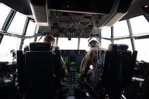 U.S. Air Force pilots assigned to the 40th Airlift Squadron conduct preflight checks on a C-130J within the U.S. Central Command area of responsibility, June 6, 2025. The 40th AS mission includes transporting personnel, equipment, and supplies and supporting humanitarian and contingency operations across the globe. (U.S. Air Force photo by Senior Airman Dieondiere Jefferies)