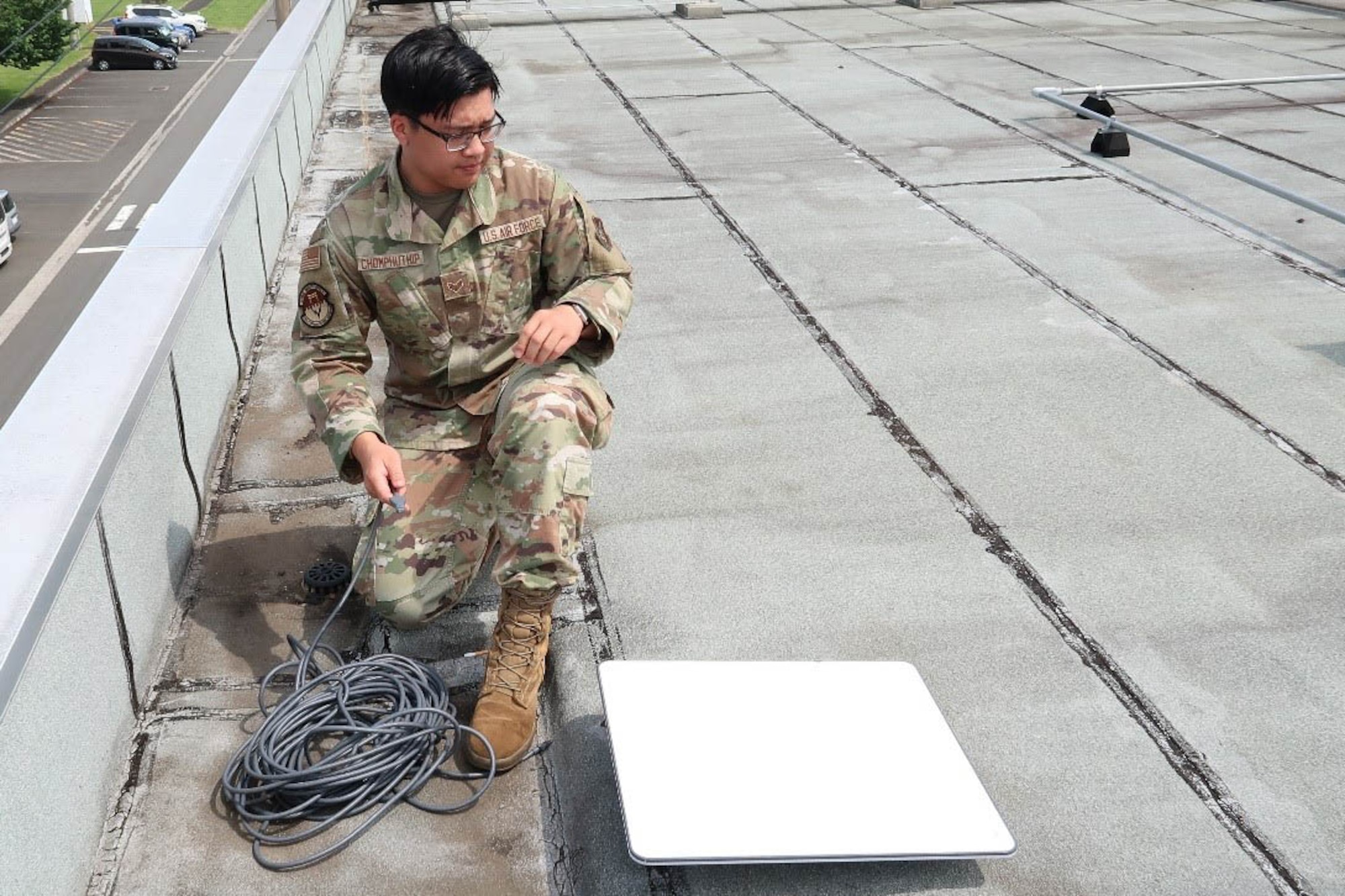 Airman sets up communications fly-away kit.