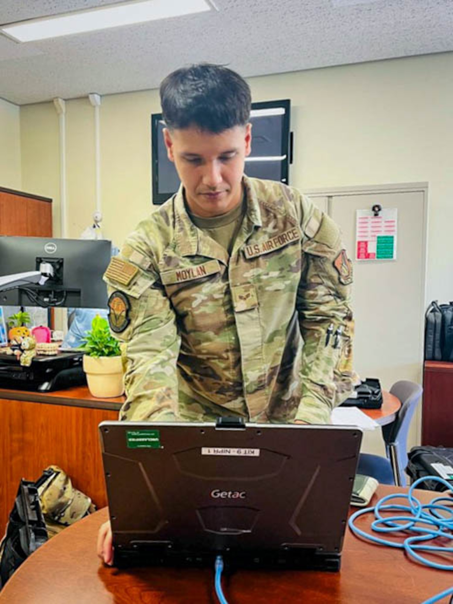 Airman works on computer.