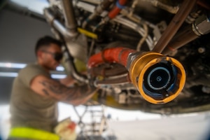 U.S. Air Force Staff Sgt. Bryan Caldera, 32nd Expeditionary Air Refueling Squadron aerospace propulsion technician, replaces an oil pump on a KC-135 Stratotanker within the U.S. Central Command area of responsibility, June 4, 2025. The 32nd EARS delivers fuel for U.S. and coalition partners, extending the reach and combat effectiveness of airpower to the region. (U.S. Air Force photo by Staff Sgt. Sean Moriarty)