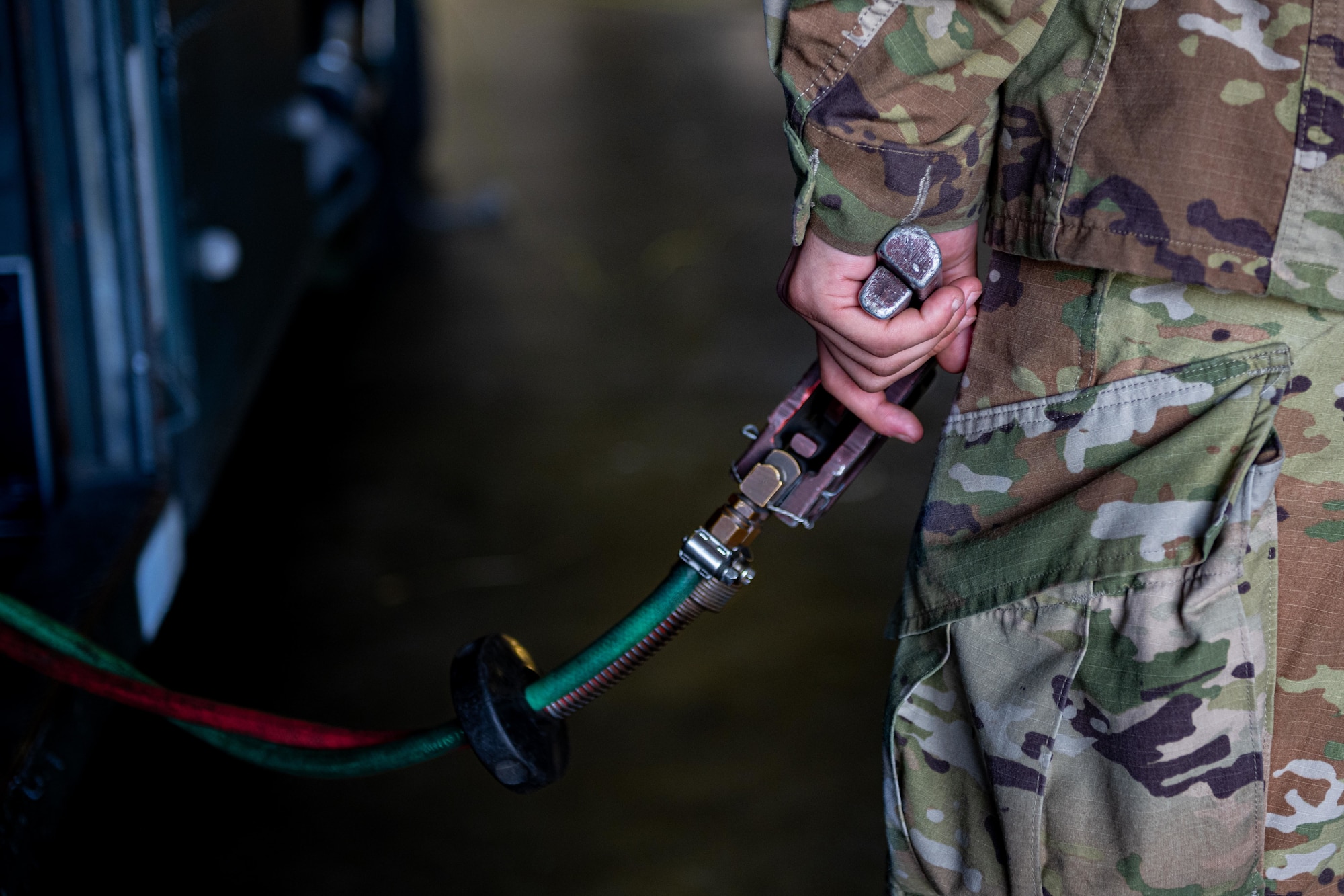 U.S. Air Force Airman 1st Class Andrews Mikel, 35th Logistic Readiness Squadron fuels distribution operator, holds the deadman switch of an R-11 fueling truck during an F-16 Fighting Falcon fuel run at Misawa Air Base, June 10, 2025.