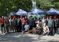 A team from Army Field Support Battalion-Poland pose for a photo with local community members from Września, Poland, at the Września Rifleman’s Brotherhood 100th Anniversary Celebration May 31, 2025. Since AFSBn-Poland officially activated last September in Powidz, Poland, they’ve placed great emphasis on fostering relationships with the host nation and local communities near their Army Prepositioned Stocks-2 worksite. (Courtesy photo)