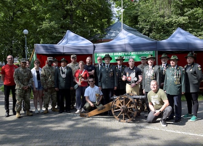 A team from Army Field Support Battalion-Poland pose for a photo with local community members from Września, Poland, at the Września Rifleman’s Brotherhood 100th Anniversary Celebration May 31, 2025. Since AFSBn-Poland officially activated last September in Powidz, Poland, they’ve placed great emphasis on fostering relationships with the host nation and local communities near their Army Prepositioned Stocks-2 worksite. (Courtesy photo)