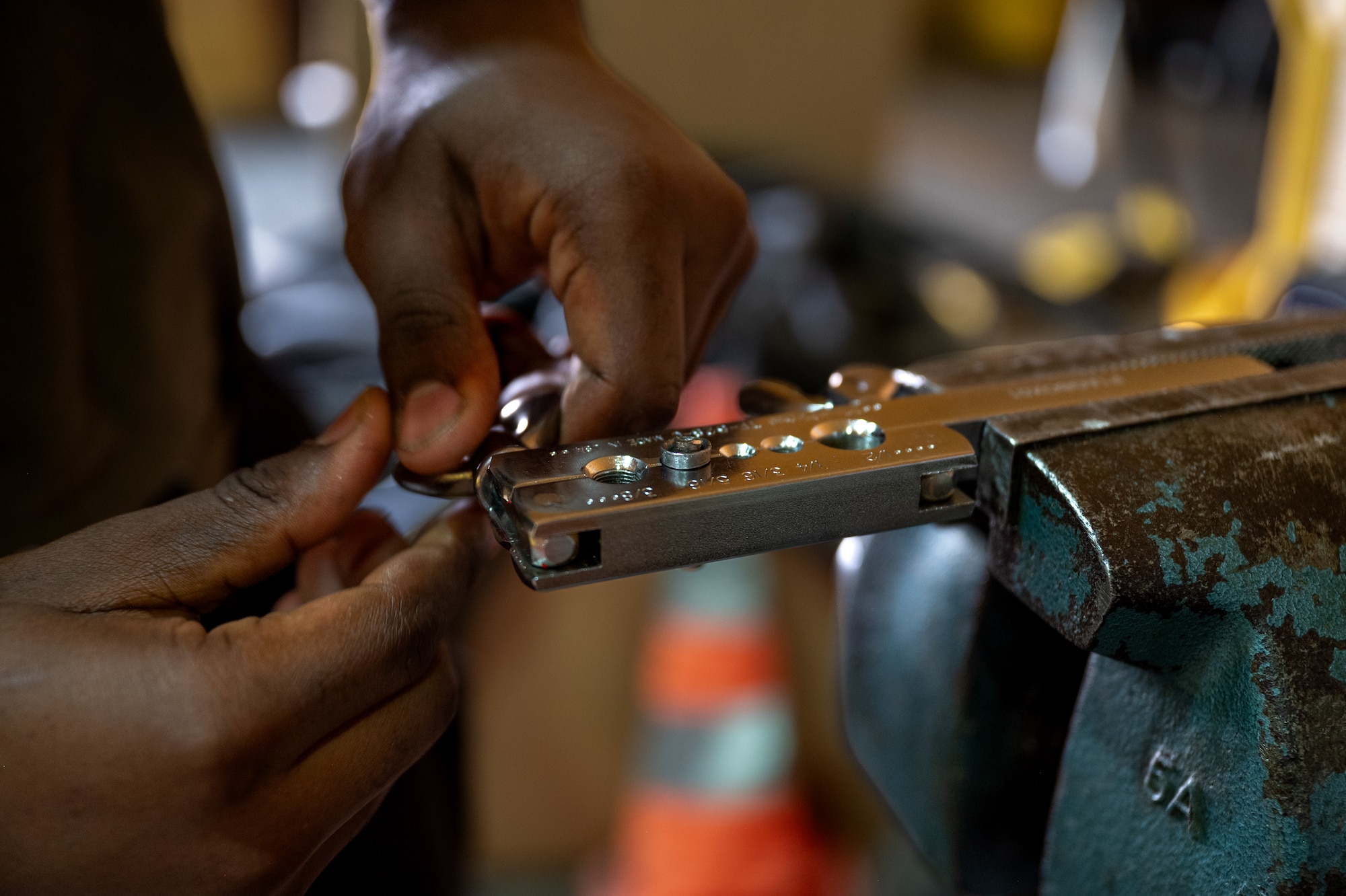 Airman attaches a metal seal to a flaring assembly kit