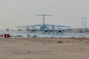 Five U.S. Air Force F-16C Fighting Falcons taxi.