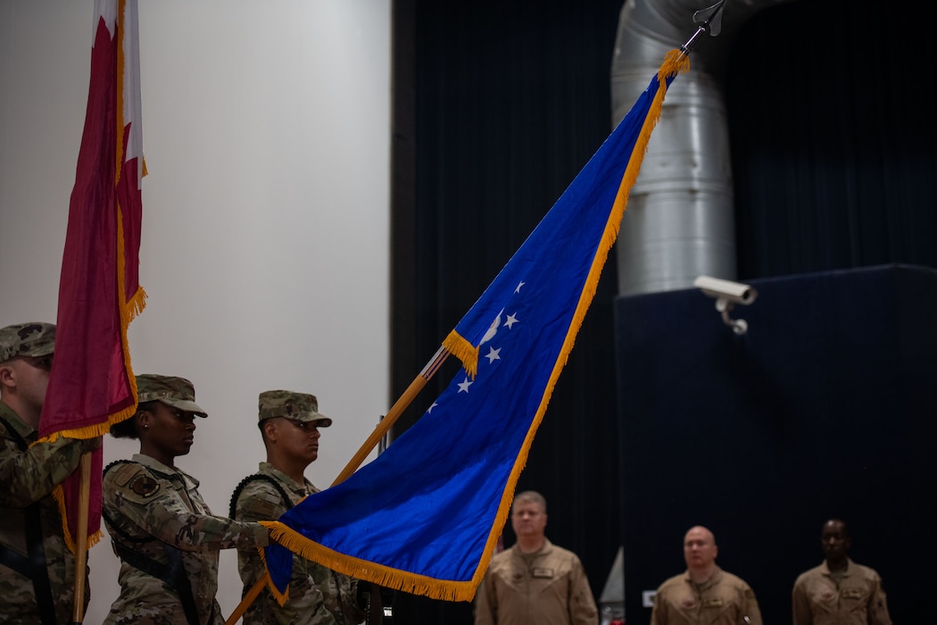 Members of the 379th Air Expeditionary Wing honor guard present colors during the 379th AEW Change of Command Ceremony within the U.S. Central Command area of responsibility, June 9, 2025. The ceremony saw Brig. Gen. Richard Dickens relinquish command to Brig. Gen. Travis Edwards. (U.S. Air Force photo by Staff Sgt. Sean Moriarty)