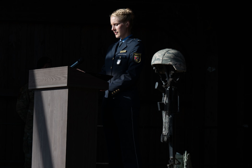 A police officer delivers remarks while standing behind a podium.