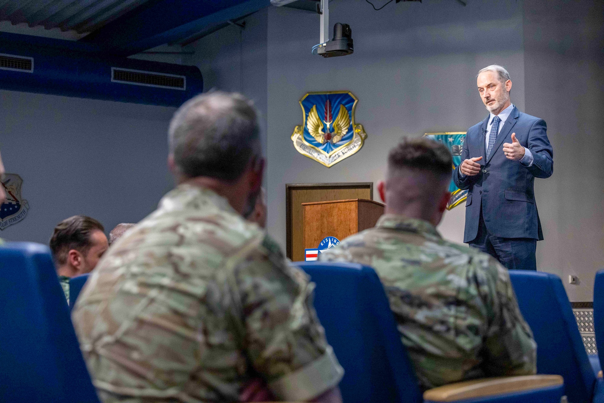 Retired U.S. Air Force Senior Master Sgt. Travis Robbins speaks to the U.S. Inter-European Air Forces Academy Class 25B students at Kisling Auditorium, Kapaun Air Station, Germany, May 19, 2025. Robbins, who helped build IEAFA from the ground up, urged students to lead with urgency and purpose, reminding them that coalitions only succeed when preparation becomes habit. (Photo by Terrance Rhodes, IEAFA Strategic Communications Analyst)