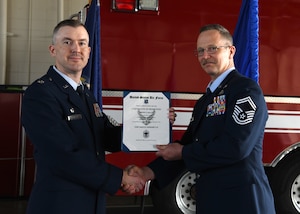 U.S. Air Force Lt. Col. Kevin Lawhon, left, interim commander of the 106th Communications Squadron, promotes U.S. Air Force Senior Master Sgt. Timothy Daniel Malloy, right, the squadron’s senior enlisted leader, to chief master sergeant during a ceremony at Francis S. Gabreski Air National Guard Base, Westhampton Beach, N.Y., June 6, 2025.