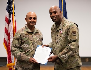 U.S. Air Force Lt. Col. Mark Wilborn, right, receives the Meritorious Service Medal from Col. Sanjay Shetty, left, commander of the 106th Medical Group, during Wilborn’s retirement ceremony at Francis S. Gabreski Air National Guard Base, Westhampton Beach, N.Y., June 7, 2025.
