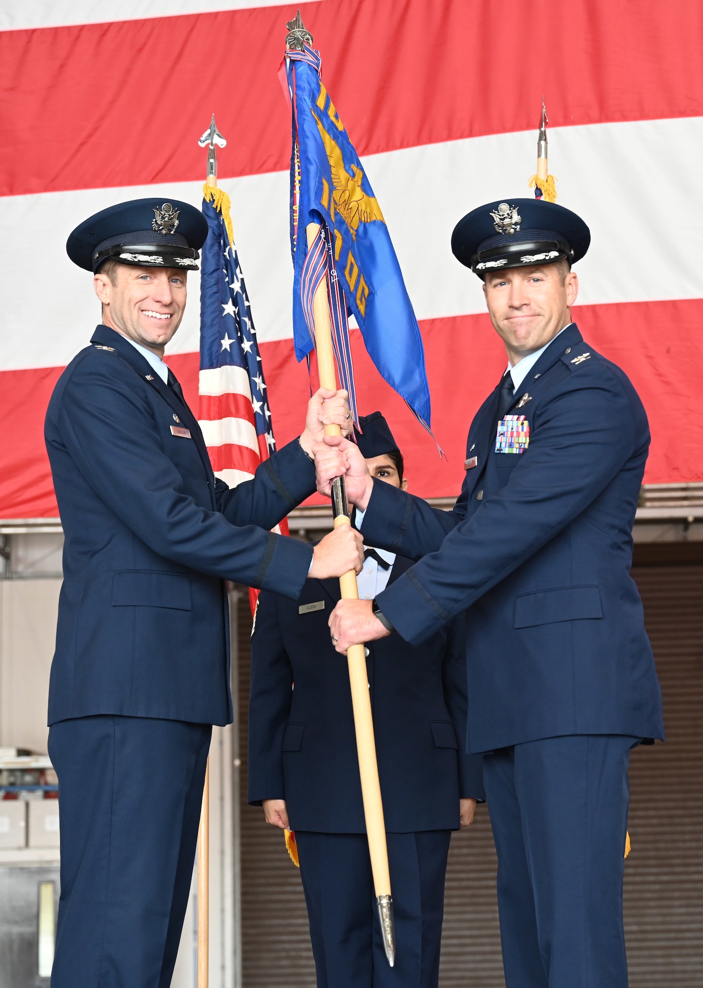 U.S. Air Force Col. Scott Korell, left, incoming 100th Operations Group commander, addresses 100th OG Airmen and audience members at his change of command ceremony at RAF Mildenhall, England, June 10, 2025.