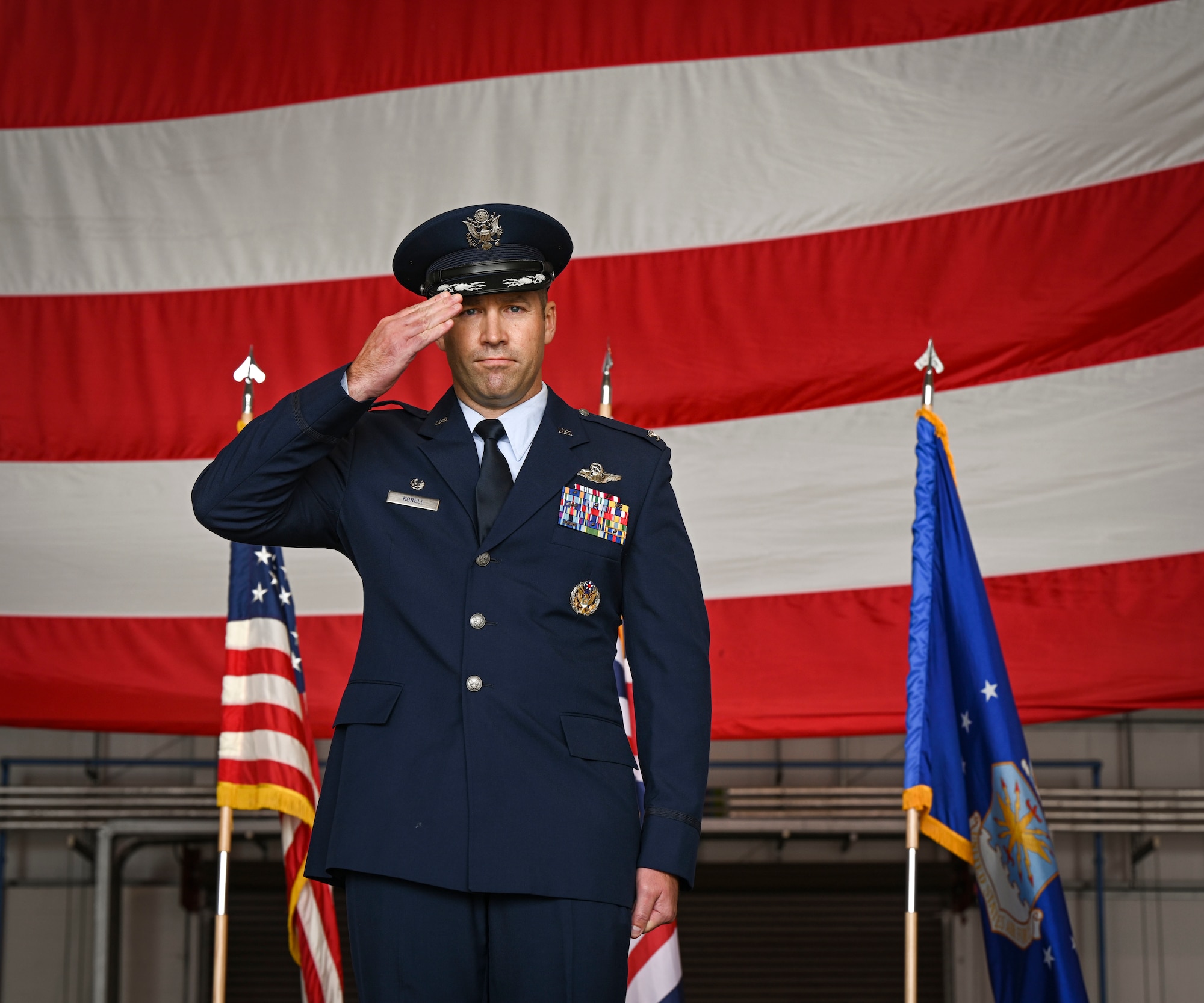 U.S. Air Force Col. Scott Korell, 100th Operations Group commander, renders a salute to Airmen during his change of command ceremony at RAF Mildenhall, England, June 10, 2025.