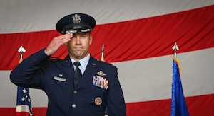U.S. Air Force Col. Scott Korell, 100th Operations Group commander, renders a salute to Airmen during his change of command ceremony at RAF Mildenhall, England, June 10, 2025.