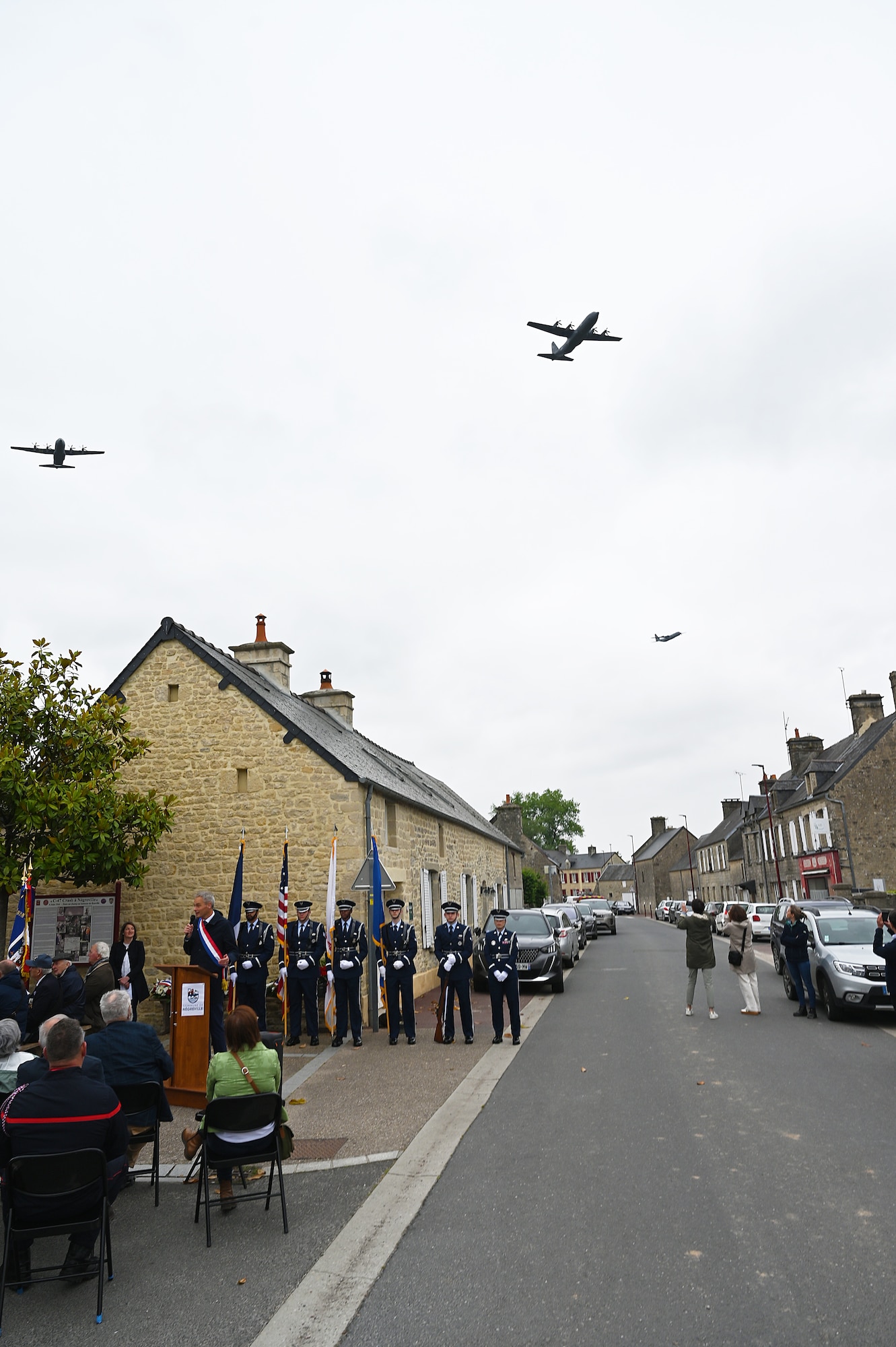A flyover of C-130Js  from the 37th Airlift Squadron crosses the skies of Nègreville, France during a ceremony highlighted the sacrifices of the crew and paratroopers of a C-47 Skytrain that crashed during D-Day, June 3, 2025. (Photo by Capt. Lou Burton, 435th AGOW Public Affairs)