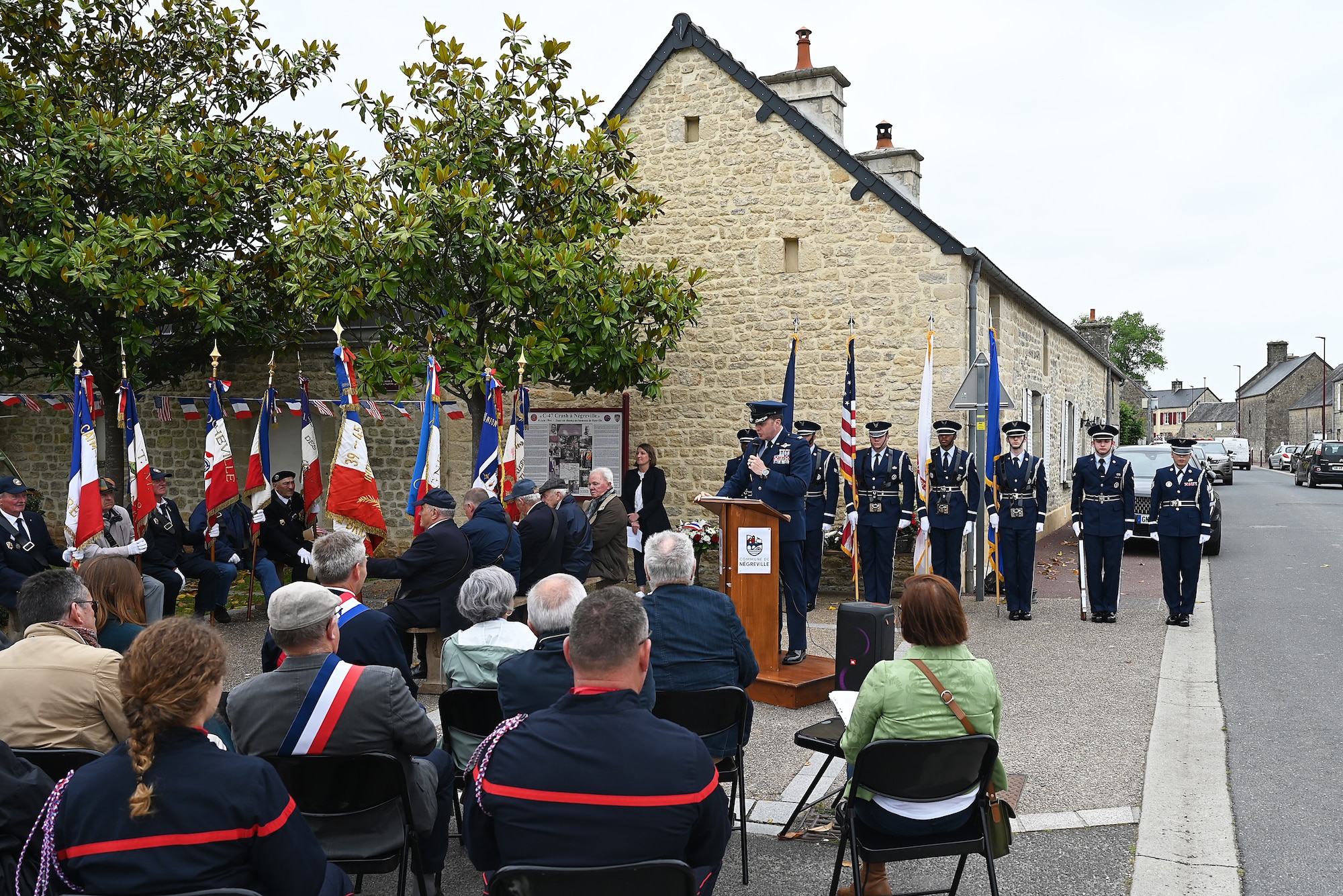 Col. Matthew Bartlett, 435th Air Ground Operations Wing commander delivers a speech in both French and English during a ceremony highlighted the sacrifices of the crew and paratroopers of a C-47 Skytrain that crashed during D-Day, June 3, 2025. Bartlett, whose wing consists of over 1,400 personnel across 11 installations in Europe and the U.S., emphasized the importance of connecting with the courage and sacrifice of the D-Day generation. (Photo by Capt. Lou Burton, 435th AGOW Public Affairs)