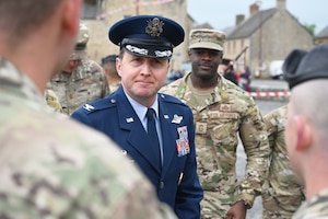 Col. Matthew Bartlett, 435th Air Ground Operations Wing commander meets with members of his wing prior to a D-Day commemoration ceremony in Picauville, France, June 3, 2025.  (Photo by Capt Lou Burton, 435th AGOW Public Affairs)