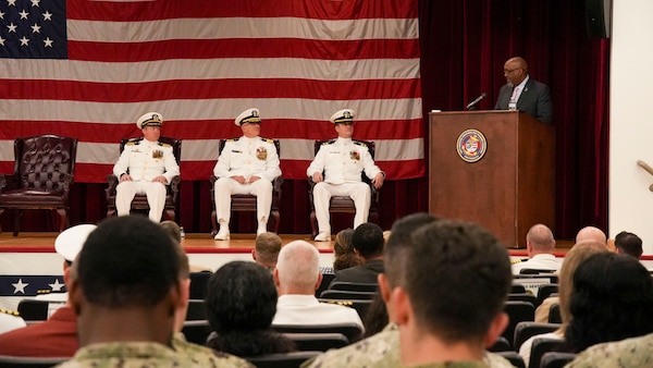 250609-O-NJ594-1009, Portsmouth, Virginia, (June 6, 2025) Mr. Oscar (Sean) Friendly, the deputy director for Defense Health Agency speaks the audience during a change of command ceremony held on board Hampton Roads - Portsmouth Annex, June 6, 2025. During his speech, Friendly highlighted Capt. Marion Gregg’s accomplishments as the commander of the Navy and Marine Corps Force Health Protection Command and director of Defense Centers for Public Health Portsmouth (DCPH-P). A change of command is a time-honored military tradition that signifies the formal transfer of authority, responsibility, and accountability from one leader to another. Gregg will transfer to U.S. Naval Forces Central Command (COMUSNAVCENT) where he will serve as the Fifth Fleet Force Surgeon. (U.S. Navy photo by Desmond Martin)