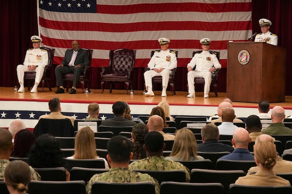 250609-O-NJ594-1014, Portsmouth, Virginia, (June 6, 2025) Capt. Marion Gregg, outgoing commander of Navy and Marine Corps Force Health Protection Command (NMCFHPC), former director of Defense Centers for Public Health Portsmouth (DCPH-P), speaks to the audience prior to reading his orders during a change of command ceremony held on board Hampton Roads - Portsmouth Annex, June 6, 2025. After serving two years as the commander Gregg will transfer to U.S. Naval Forces Central Command (COMUSNAVCENT) where he will serve as the Fifth Fleet Force Surgeon. (U.S. Navy photo by Desmond Martin)