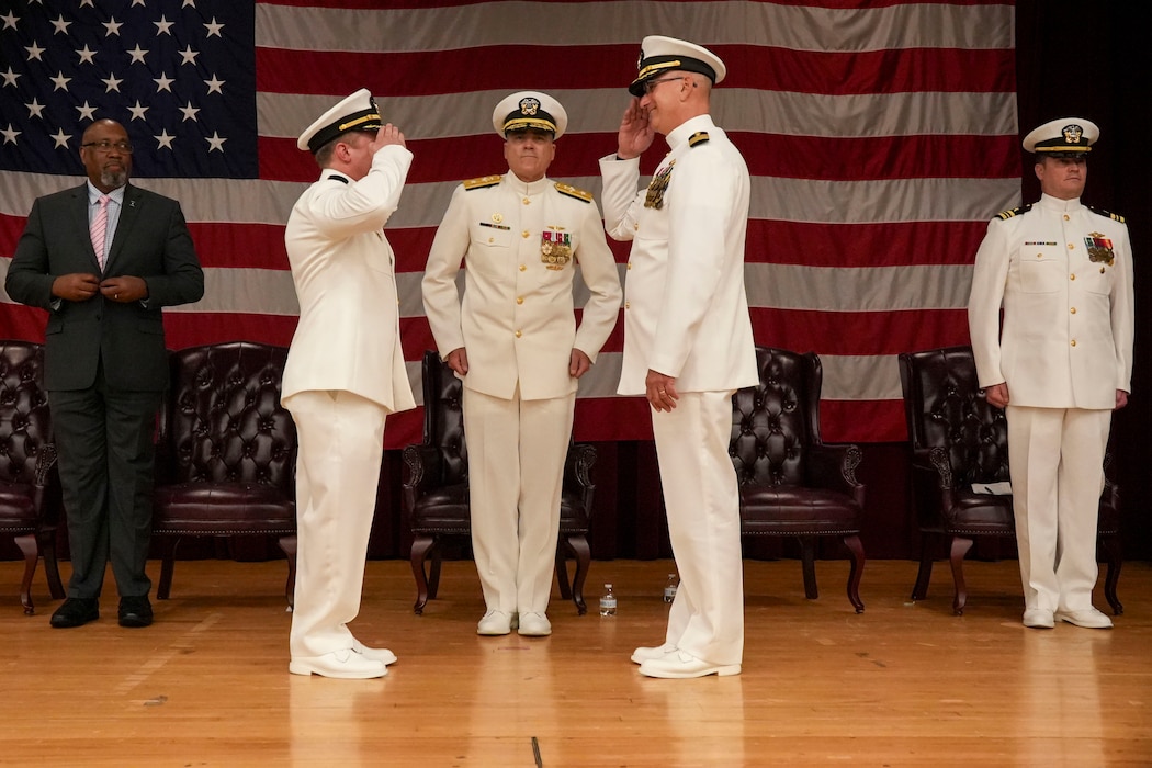 250609-O-NJ594-1015, Portsmouth, Virginia, (June 6, 2025) Capt. Marion Gregg, the outgoing commander of Navy Marine Corps Force Health Protection Command (NMCFHPC), former director of Defense Centers for Public Health Portsmouth (DCPH-P) salutes Capt. Darryl P. Arfsten, the oncoming commander of NMCFHPC, director of DCPH-P, in front of the presiding officer of the ceremony, Rear Adm. Kevin Brown, commander of Naval Medical Forces Atlantic, as he is relieved of duties during a change of command ceremony held on board Hampton Roads - Portsmouth Annex, Portsmouth, Virginia, June 6, 2025. Gregg will be transferring to U.S. Naval Forces Central Command (COMUSNAVCENT) where he will serve as the Fifth Fleet Force Surgeon. (U.S. Navy photo by Desmond Martin)
