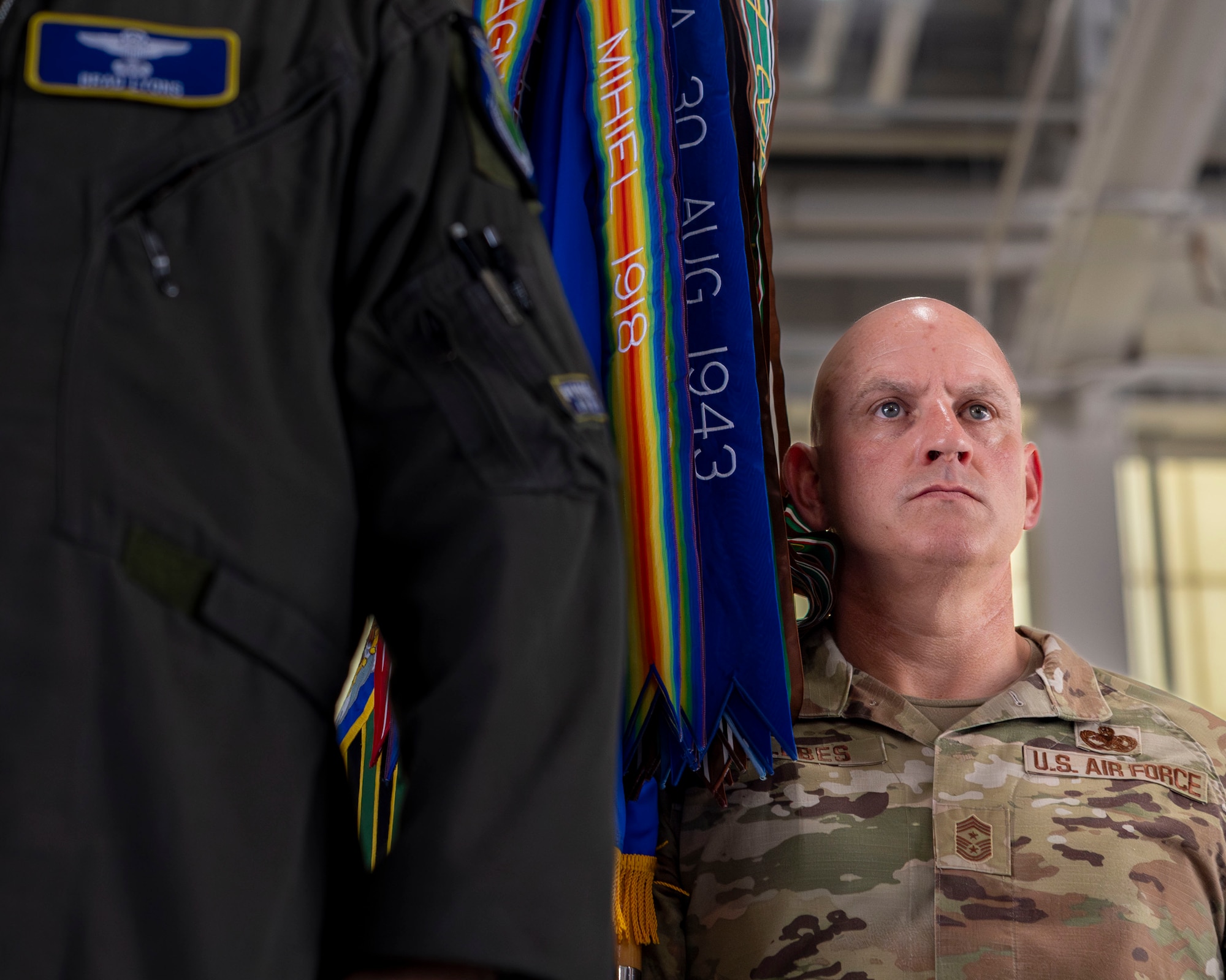 U.S. Air Force Chief Master Sgt. Michael Klebes, 1st Fighter Wing command chief, stands at attention during a change of command ceremony at the 71st Fighter Squadron, Langley Air Force Base, June 6, 2025. The 1st Fighter Wing is responsible for allowing the joint force the freedom to attack and freedom from attack in the air domain. (U.S. Air Force Staff Sgt. Lauren Cobin)