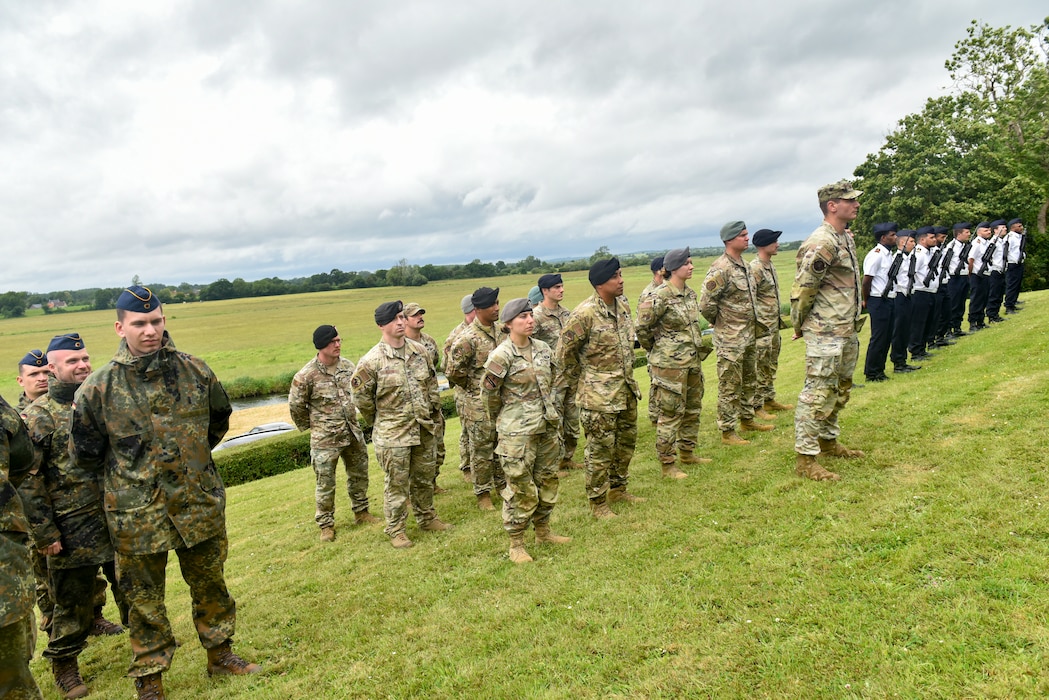 International servicemembers stand in formation