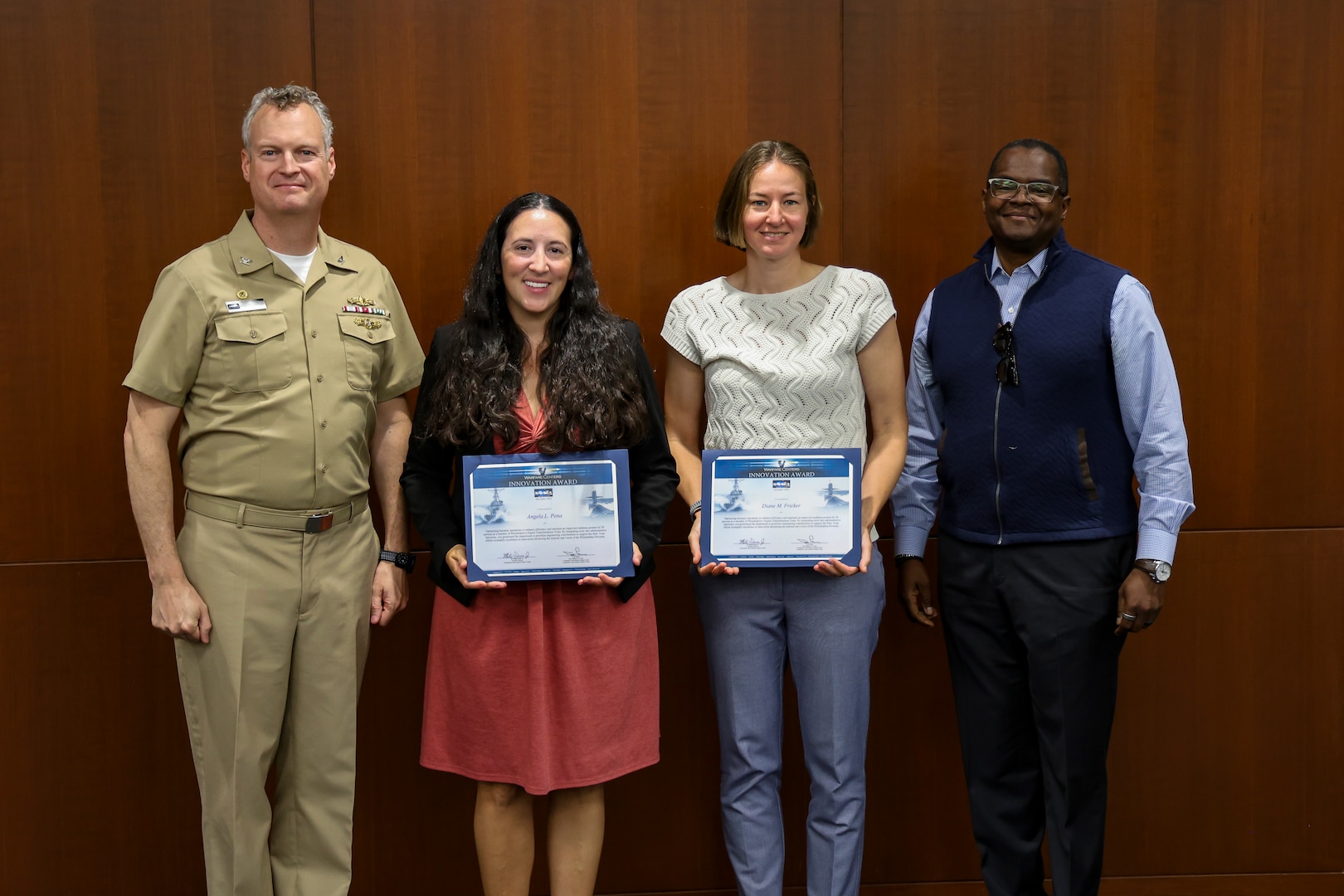 Naval Surface Warfare Center, Philadelphia Division (NSWCPD) honored employees during its Fiscal Year (FY) 2025 Third Quarter Awards Ceremony on June 3, 2025. NSWCPD’s Digital Transformation Team was awarded with a 2024 Warfare Centers Award in Innovation. Accepting the award (from left to right) were Angela Pena and Diane Fricker with NSWCPD Commanding Officer Capt. Joseph Darcy on far left and NSWCPD Technical Director Nigel C. Thijs, SES on far right. (U.S. Navy photo by Jay Butterbaugh/Released)
