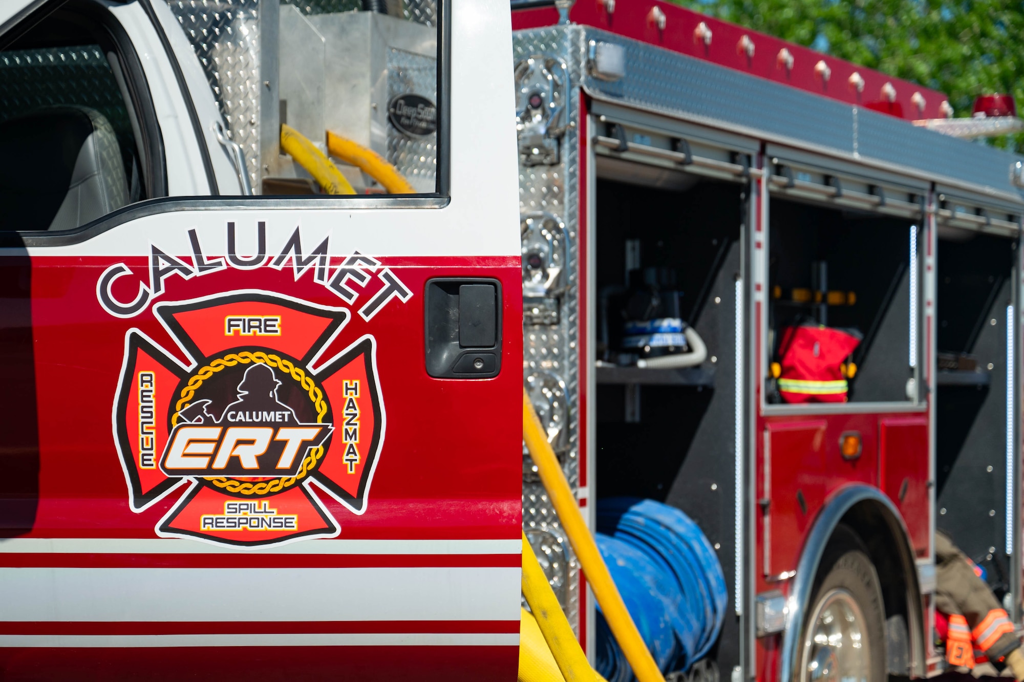 Firetruck with driver door and storage doors open