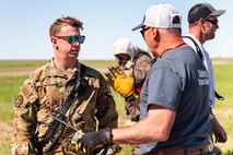 Airman and civilian talking