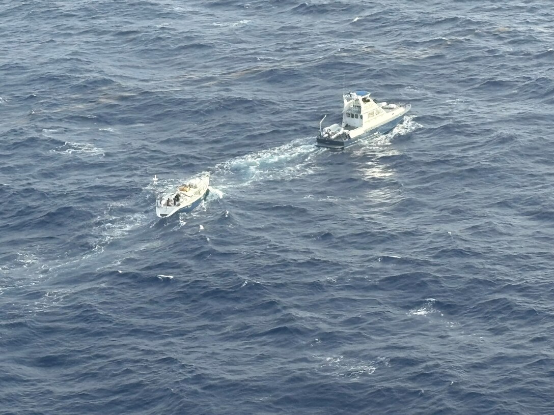 A British Virgin Islands Royal Marine Police surface unit tows demasted sailing vessel Topaze, with one mariner aboard, after the vessel transmitted a distress signal that was received by US Coast Guard Sector San Juan watchstanders, June 10, 2025. British Virgin Islands Royal Marine Police, U.S. Coast Guard, and Dutch Caribbean Coast Guard air and surface units involved in the case helped ensure the vessel and mariner reached safe harbor in Tortola, British Virgin Islands. (U.S. Coast Guard photo)