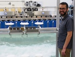 U.S. Naval Research Laboratory (NRL)-National Research Council (NRC) Postdoctoral Fellow with NRL’s Chemistry Division, Center for Corrosion Science and Engineering, Alex Johnson, next to symmetric airfoils used for measuring dry deposition of chloride and sulfate. This is used to study the impact of corrosion from saltwater aerosols at the NRL Laboratory for Autonomous Systems Research (LASR) Littoral Bay Wave Pool, in Washington, D.C., Sept. 24, 2024.