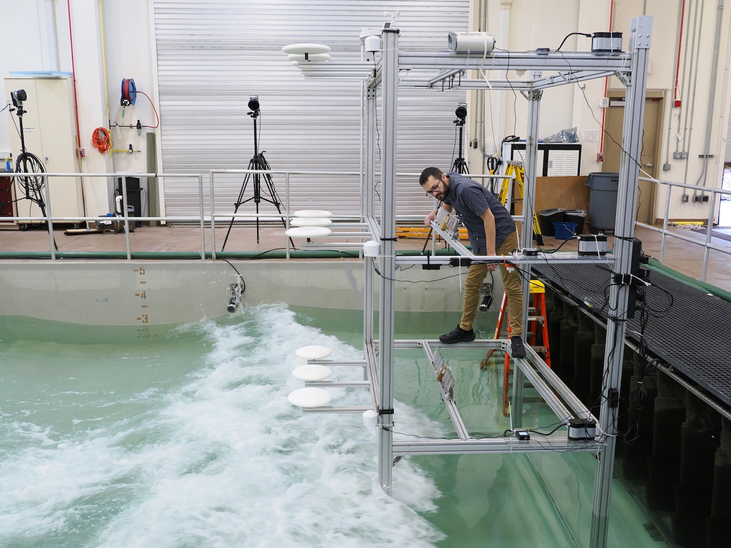 U.S. Naval Research Laboratory (NRL)-National Research Council (NRC) Postdoctoral Fellow with NRL’s Chemistry Division, Center for Corrosion Science and Engineering, Alex Johnson, studies the impact of corrosion from saltwater aerosols at the NRL Laboratory for Autonomous Systems Research (LASR) Littoral Bay Wave Pool, in Washington, D.C., Sept. 24, 2024.