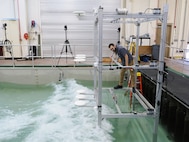 U.S. Naval Research Laboratory (NRL)-National Research Council (NRC) Postdoctoral Fellow with NRL’s Chemistry Division, Center for Corrosion Science and Engineering, Alex Johnson, studies the impact of corrosion from saltwater aerosols at the NRL Laboratory for Autonomous Systems Research (LASR) Littoral Bay Wave Pool, in Washington, D.C., Sept. 24, 2024.