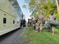 New York Army National Guard Soldiers of the 27th Infantry Brigade Combat Team load their gear onto a bus as they prepare to depart for Washington D.C. on June 11, 2025 at Hancock Air National Guard Base in Syracuse, New York to take part in the Army’s 250th Birthday Parade in Washington, D.C.