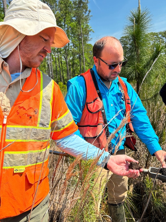 Charleston District project managers Ben Burdette and David Wilson examine soils